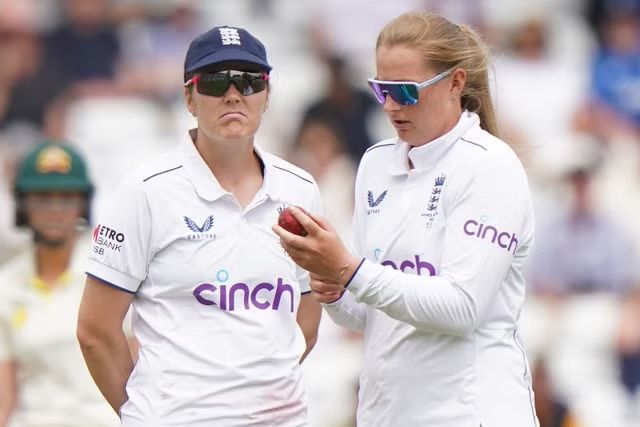 Heather Knight at cricket field with her team . Source: The Independent 